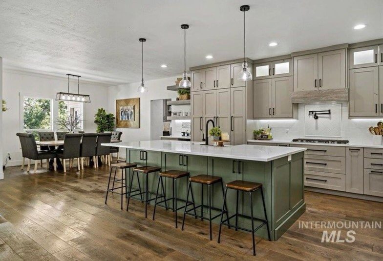 Wide greige kitchen with green island
