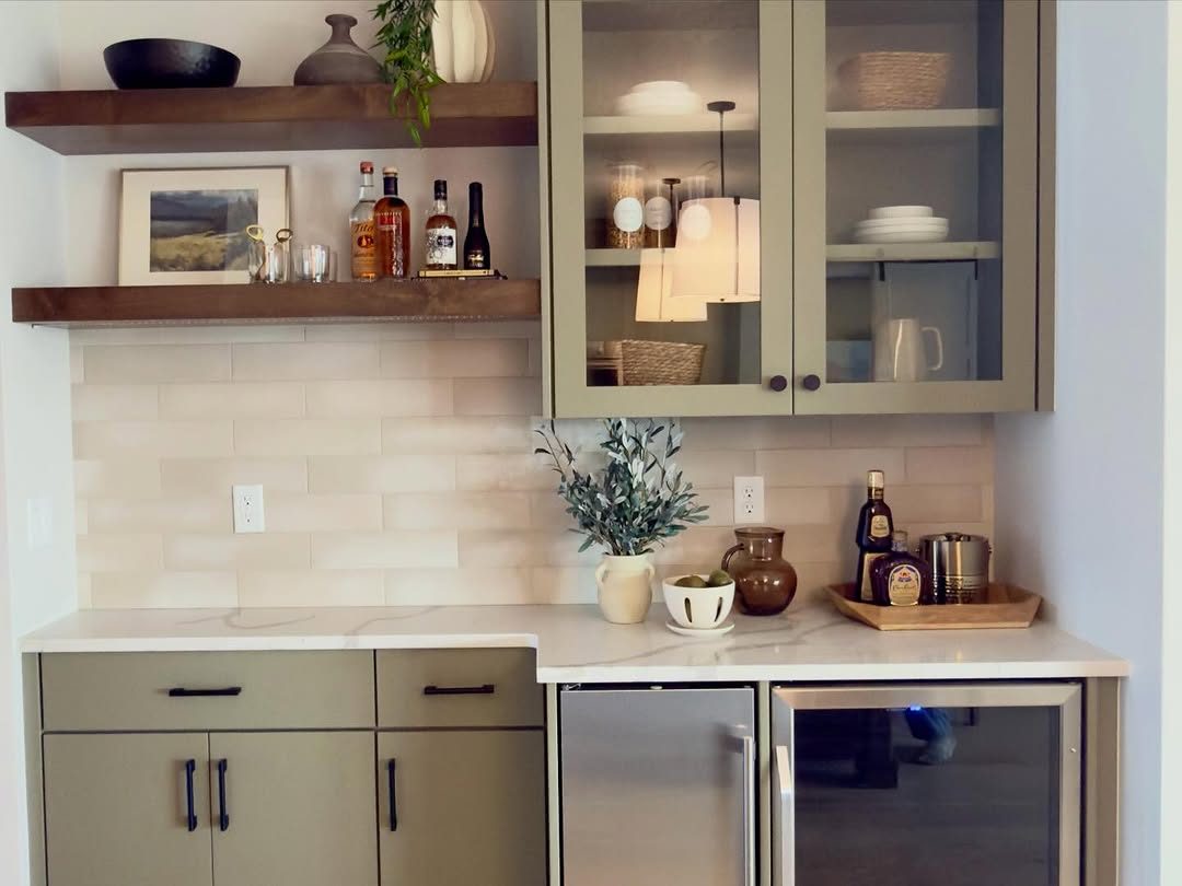 Sage cabinetry with floating shelves